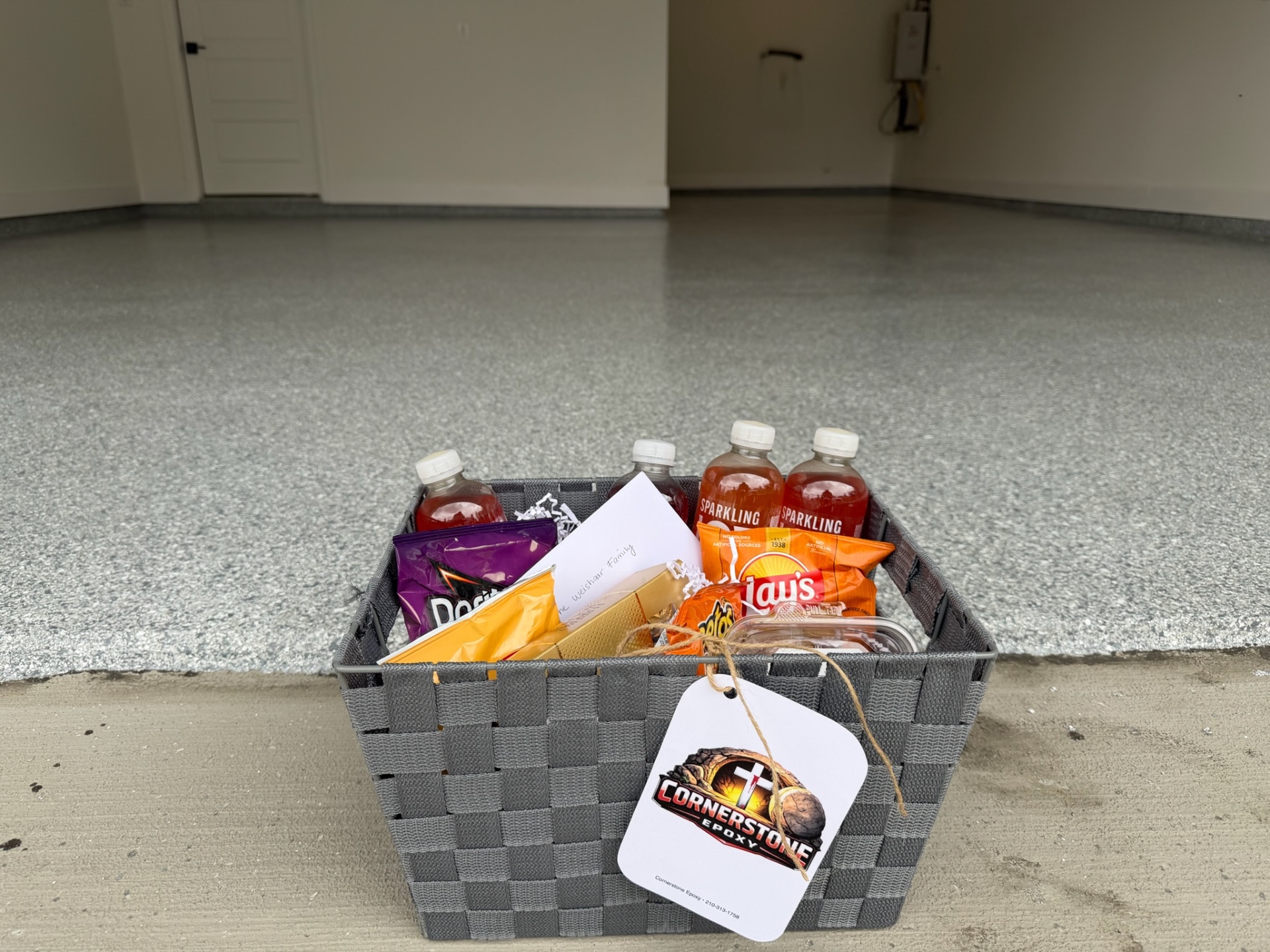 Customer thank-you basket on a finished garage floor